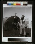 [Black fighter pilot series--pilot with parachute room in background, Ramitelli, Italy]