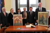 Doug Berry and Burkley Allen of Sister Cities of Nashville present commemorative “Spirit of Nashville” flood relief posters to Dr. Lutz Trümper, mayor of Magdeburg, Germany, Nashville’s sister city, in October of 2010