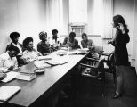 An unidentified woman teaches a class of Educational Opportunity Program students, 1973