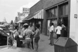 James "Son" Thomas and Joe Cooper, Leland, Mississippi. Street scene, cafe. (JTP 6-76-3)