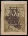 [Military railroad operations in northern Virginia: two men boring holes in bridge trestles and man with Haupt's Torpedo]