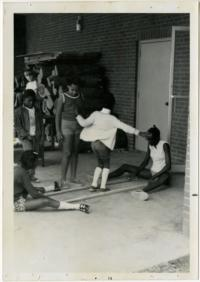 Children Jumping Over Sticks