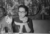 Robert Flowers and Amy Peppler seated at a table at a club, probably in Montgomery, Alabama.