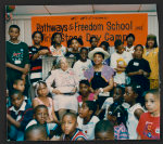 [Rosa Parks and Elaine Steele sitting with children enrolled in the Rosa &amp; Raymond Parks Institute "Pathways to Freedom School and Tri-State day camp", around 1990]