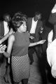 Barbara Howard Flowers, staff member at the Southern Courier, dancing at the Laicos Club in Montgomery, Alabama.