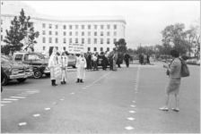 Klansmen standing in the street during a Ku Klux Klan rally in Montgomery, Alabama.