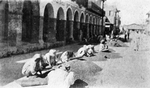 Sifting coffee along a principal street