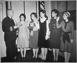 "Cmdr. Thomas A. Gaylord, USN (Ret'd), administers oath to five new Navy nurses commissioned in New York..."