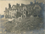 Two laborers working on Merion Hall