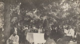 J. L. Sibley speaking to an audience in the woods in rural Alabama.