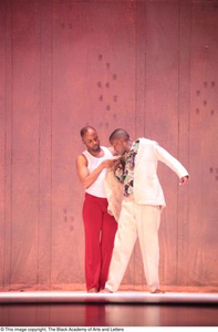 Dancer in red touching groom dancer