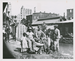 Group of freedmen, including children, gathered by a canal in Richmond, Virginia, in 1865