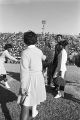 Muhammad Ali on the football field with the mascot and cheerleaders from Tuskegee Institute during homecoming activities for Alabama State College on Thanksgiving Day in Montgomery, Alabama.