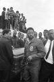 Pallbearers, including Hosea Williams, T. Y. Rogers, and James Orange, around Martin Luther King, Jr.'s casket at the burial site.