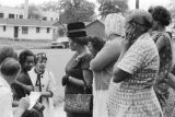 Reporter interviewing M. W. Pippen, whose granddaughter, Denise McNair, was one of the victims of the 16th Baptist Church bombing.