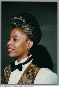 Right-angled medium close-up of a woman, wearing a badge labeled Jowi