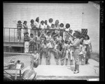 Thumbnail for Cowboy Sam Garrett demonstrating roping trick to children at Echo Park in Los Angeles, Calif., 1949