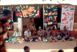 Appliqué workers, in street, Abomey, Benin