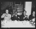 [Untitled photo, possibly related to: Luncheon for Liberian Presidential party. His Excellency, Edwin Barclay, President of the Republic of Liberia, was feted by Negro civic, social, professional and educational leaders Saturday, May 29, 1943 at a luncheon at the Lucy Diggs Slowe Hall in Washington, D.C. President-elect W.V.S. Tubman, President Barclay and Dr. Emmet J. Scott, chairman of the committee on invitation are shown drinking a toast to the President of the United States. The toast was proposed by the President of Liberia]