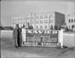 Ralph Metcalfe stands by Xavier University football schedule, 1936