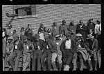 Negro flood refugees wearing identification tags after registering in the camp at Forrest City, Arkansas