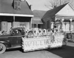 Children from the Williamson School on a Mardi Gras float in an African American neighborhood in Mobile, Alabama.