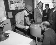 Peripheral vision test inside a mobile driving lesson bus, 1961