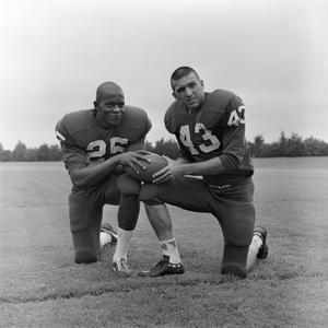 Two football players kneeling together, 3