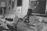 B. B. King: New Haven, Conn. Yale University. B. B. King playing guitar and singing in apartment, seated on sofa (BKP Q-74)