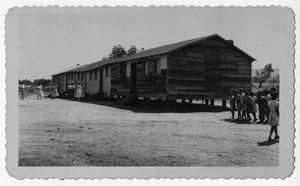 Photograph of African American students in front of wooden school buildings, Manchester, Georgia, 1953