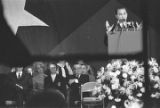 George Wallace speaking on stage at a rally in the Municipal Auditorium in Birmingham, Alabama, during Lurleen Wallace's gubernatorial campaign.