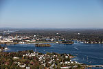 An October 2017 aerial view of the historic seaport of Portsmouth, New Hampshire, (foreground) the largest city along the shortest coastline (18 miles) of any U.S. state. In the distance, above, across the Piscataqua River in Kittery, Maine, is the Portsmouth Naval Shipyard