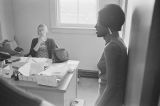 Barbara Howard Flowers talking to Mary Ellen Gale at the Southern Courier office in the Frank Leu Building in Montgomery, Alabama.