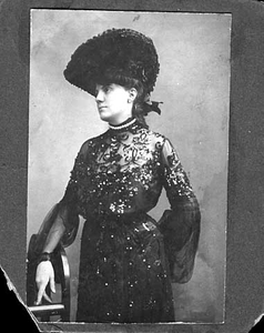 Woman in beaded dress and hat