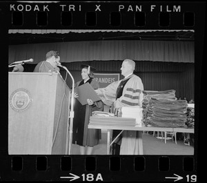 Brandeis University President Morris Abram giving an honorary degree to Coretta Scott King at the Brandeis University commencement exercises