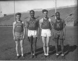 Olympic sprinter Ralph Metcalfe and three other runners at Marquette Stadium, 1933