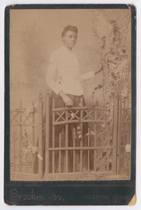 Unknown African American Woman Behind Gate