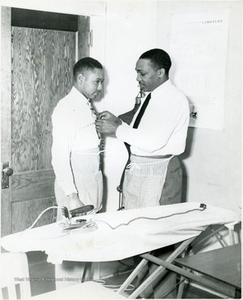 Student Measuring a Classmate in Sewing Class, Storer College, Harpers Ferry, W. Va.