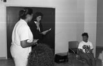 Miss Black California participants preparing with instructors, Los Angeles, 1989