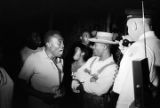 Man talking to Police Chief Drue Lackey in a neighborhood in Montgomery, Alabama, during a civil rights demonstration.