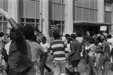 African American protestors and Klansmen at a United Klans of America march in Mobile, Alabama.