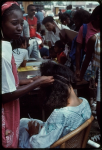 Atlanta, Georgia, 1988: National Black Arts Festival. African American hair braiding