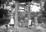 African American women and children washing clothes in rural Wilcox County, Alabama.