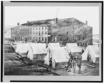 [Soldiers, other people, and tents of Confederates outside of Libby Prison, Richmond, Virginia]