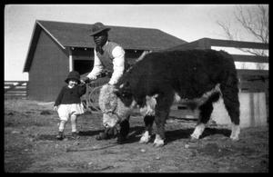 Man and Toddler with a Calf