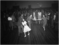 "High Hat," dance and party, African-American party, on Auburn Avenue, Atlanta, Georgia, January 21, 1943. Photo shoot commissioned by fashion and home-goods mail-order merchandizer, Chicago Mail Order Company, owned by Alden's