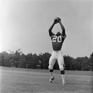 NTSU player catching a ball, 31