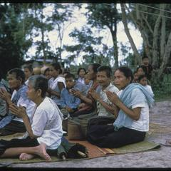 Ban Pha Khao: villagers praying (note segregation of sexes, male privacy)