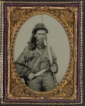 [Unidentified soldier in Confederate infantry uniform with musket and Bowie knife]