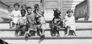 Children on front steps of first Phylliss Wheatley House on Bassett Avenue, Minneapolis.